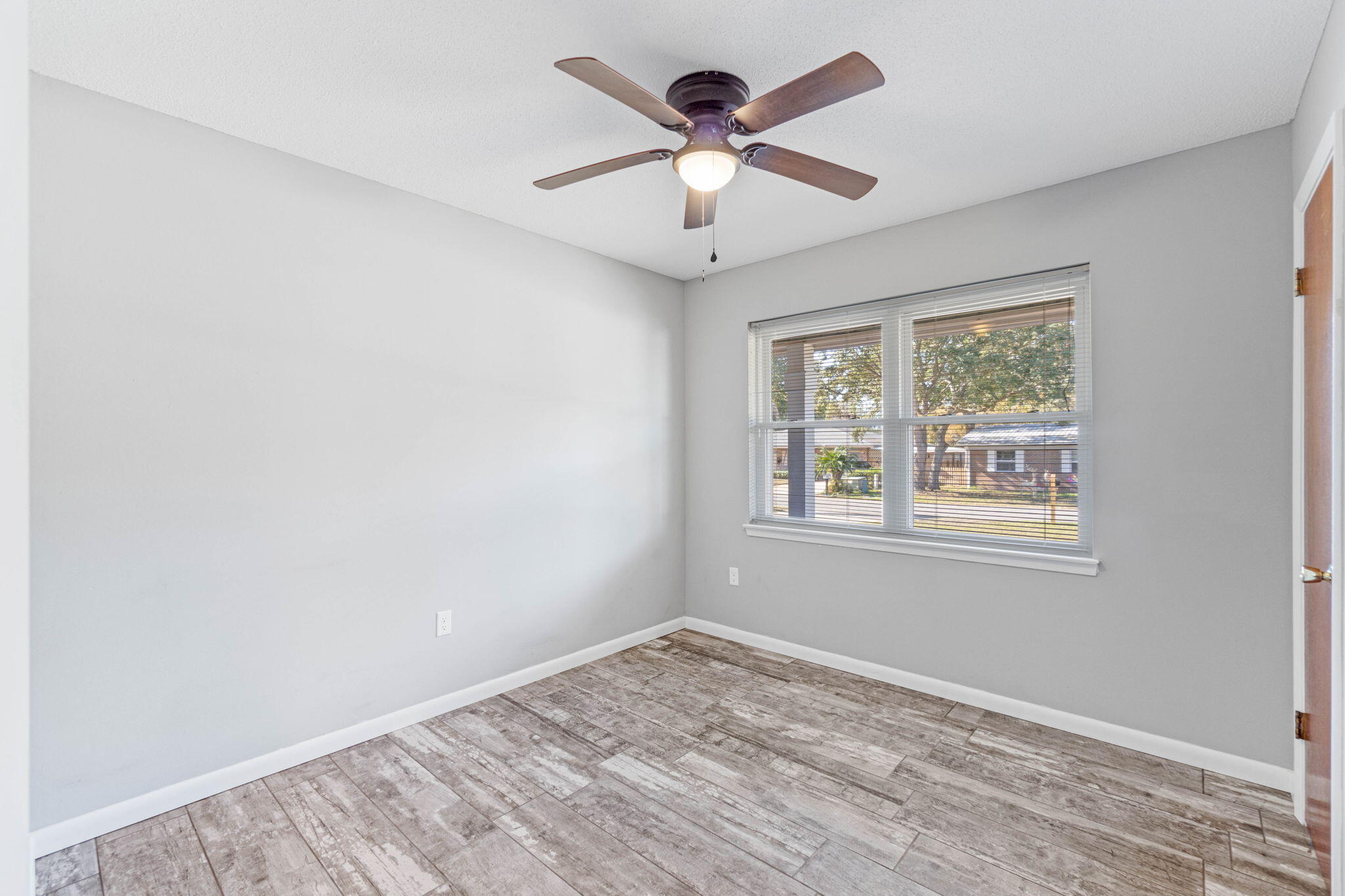 14 9th Street Shalimar, FL 32579 - Photo 15 of 29 a view of an empty room with a window