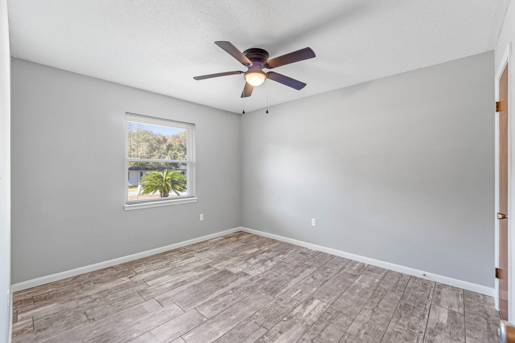 14 9th Street Shalimar, FL 32579 - Photo 18 of 29 an empty room with window and ceiling fan