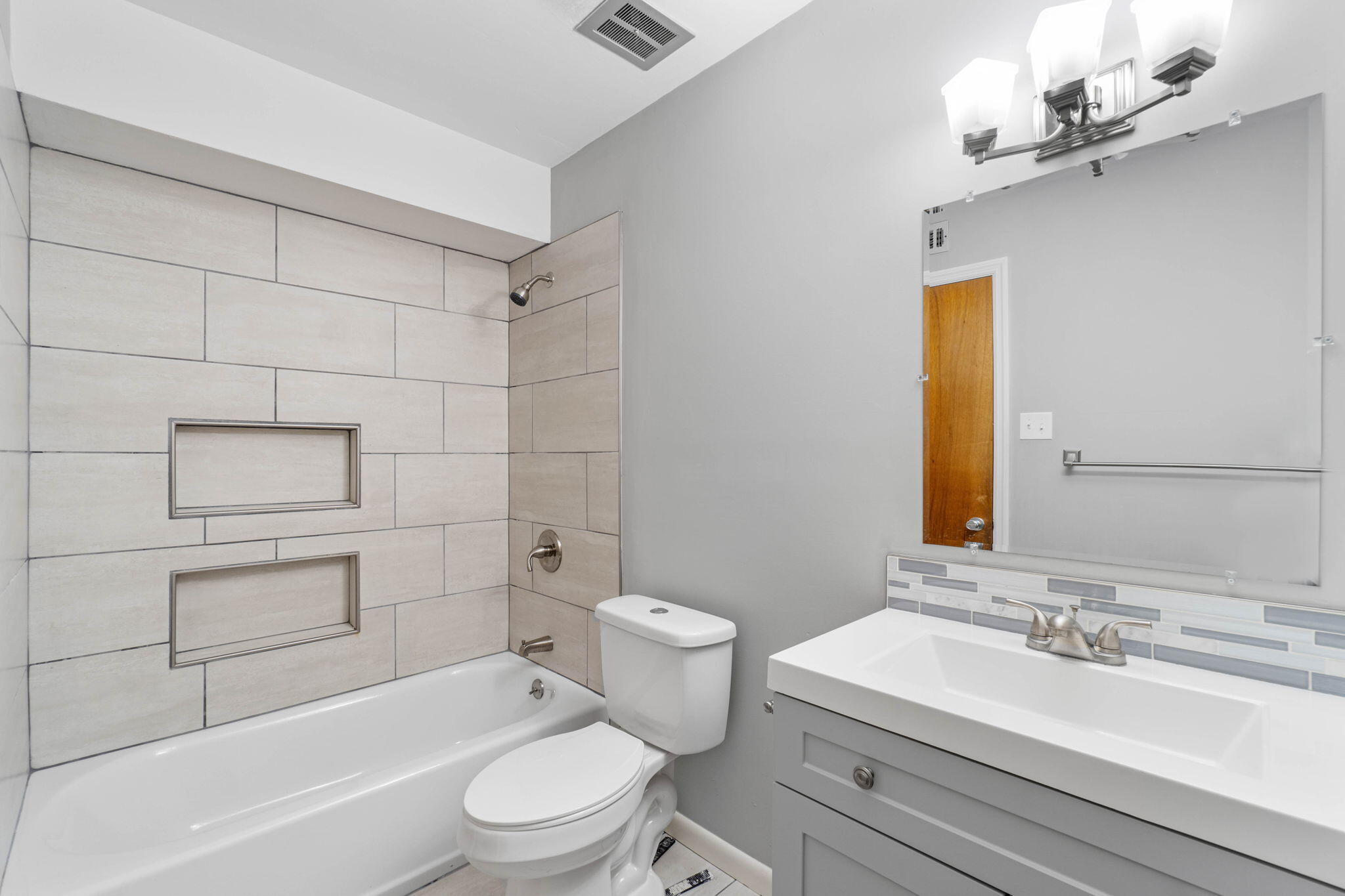 14 9th Street Shalimar, FL 32579 - Photo 22 of 29 a bathroom with a sink a toilet and shower