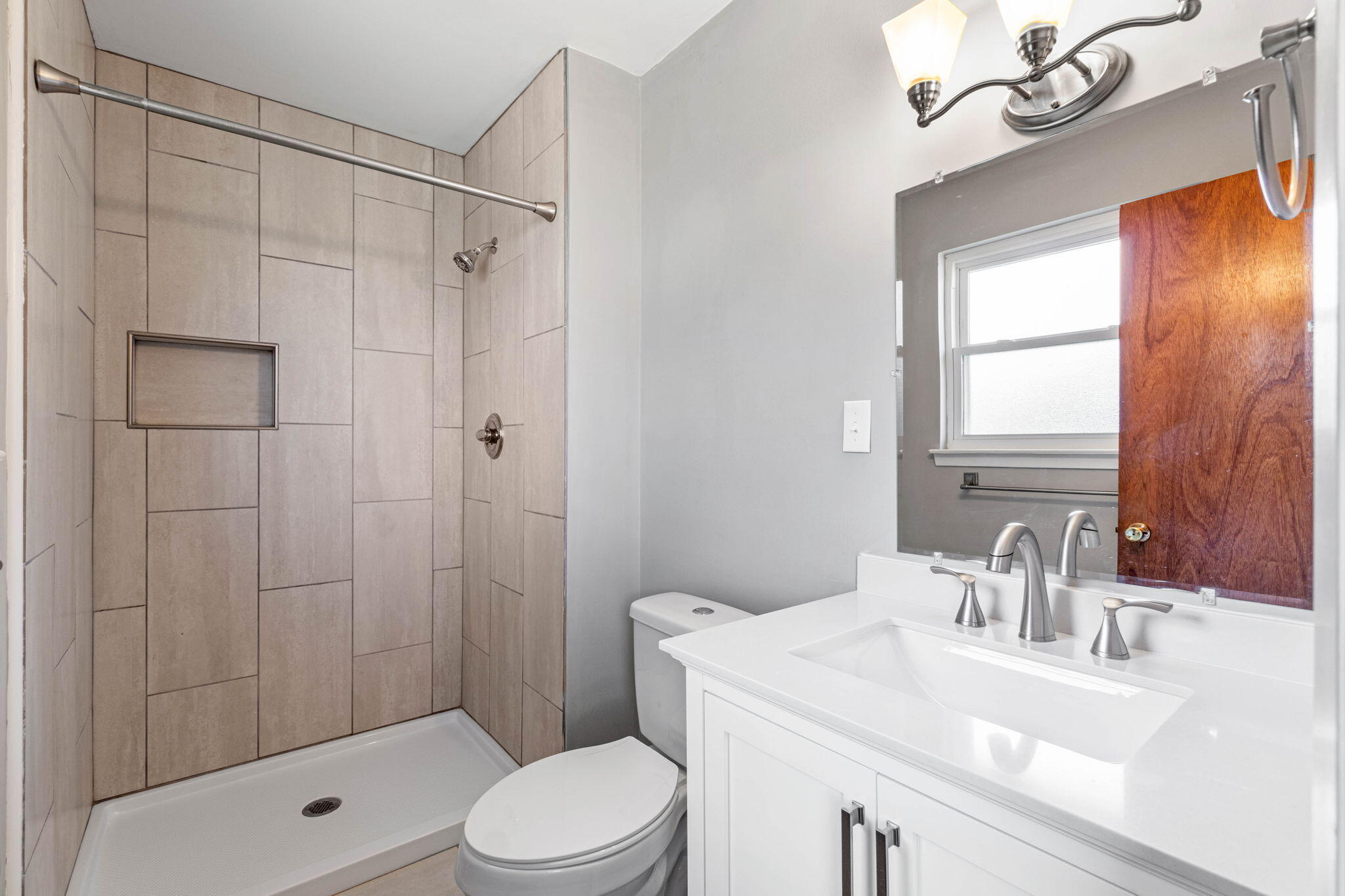 14 9th Street Shalimar, FL 32579 - Photo 26 of 29 a bathroom with a sink a toilet and shower