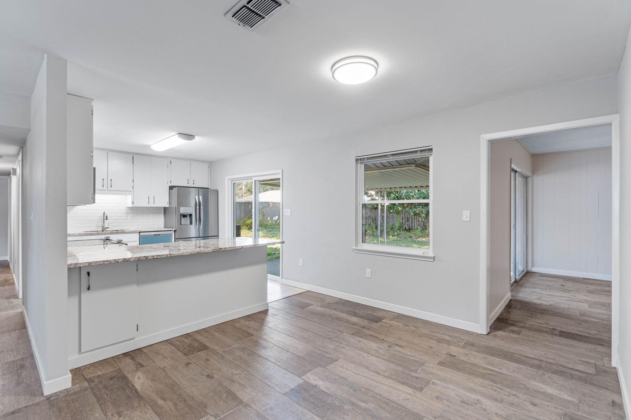 14 9th Street Shalimar, FL 32579 - Photo 7 of 29 a kitchen with stainless steel appliances granite countertop a sink a stove a refrigerator and cabinets