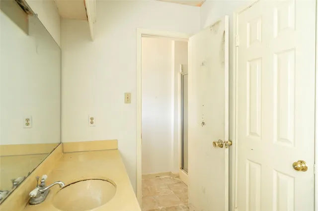 a kitchen that has a sink a stove and a table