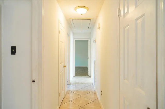 a view of a bathroom from a hallway