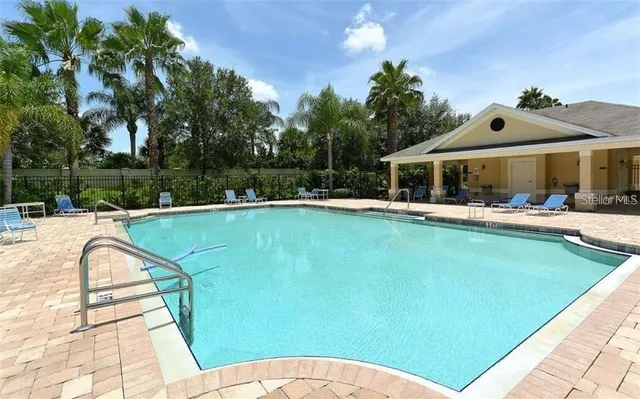 a view of a backyard with sitting area