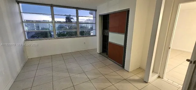 a bathroom with a granite countertop shower and a sink