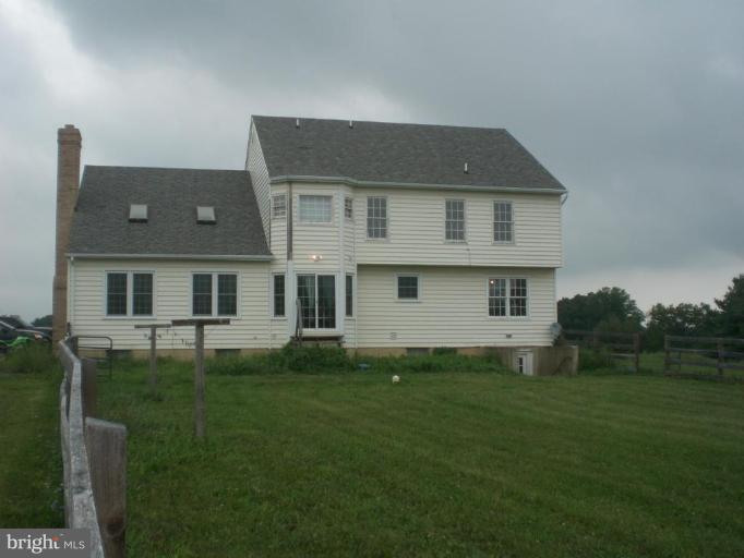 9100 Brown Church Road Mount Airy, MD 21771 - Photo 2 of 14 a front view of a house with a garden