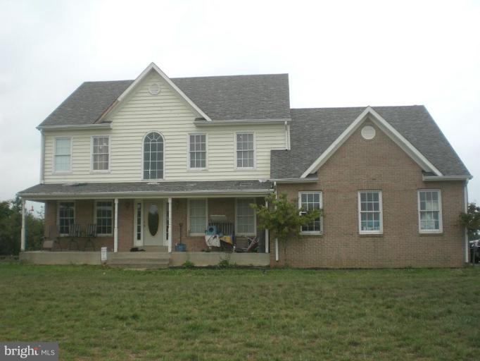 9100 Brown Church Road Mount Airy, MD 21771 - Photo 14 of 14 a front view of a house with a garden