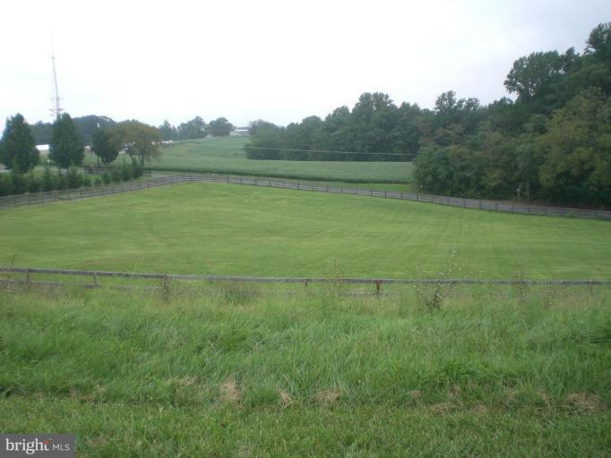 9100 Brown Church Road Mount Airy, MD 21771 - Photo 7 of 14 a view of a field with trees in the background