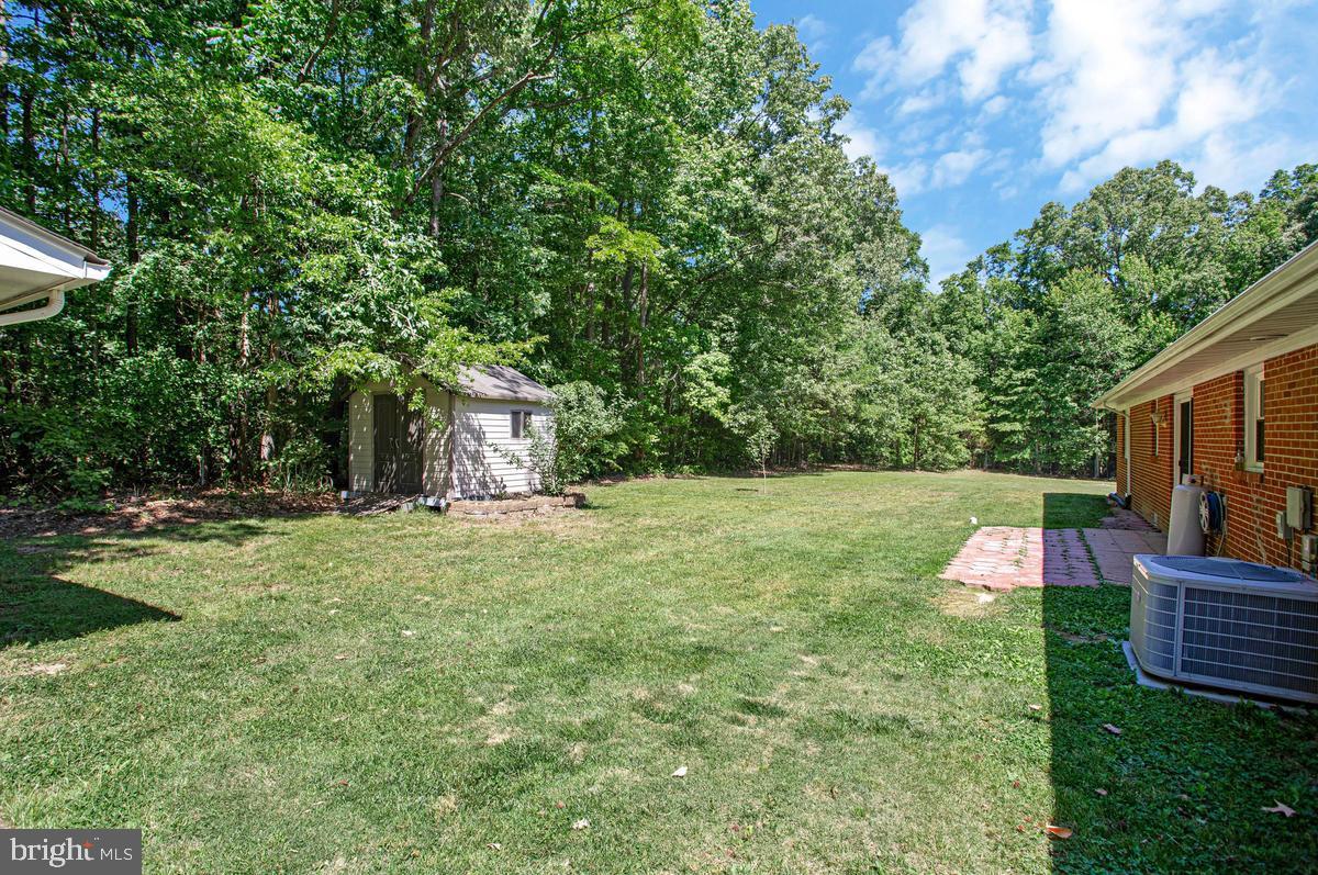 6600 Ashland Road La Plata, MD 20646 - Photo 36 of 40 a backyard of a house with lots of green space