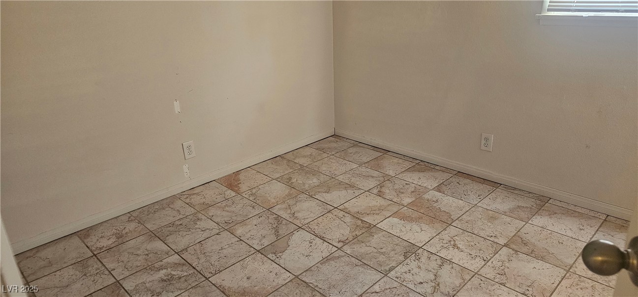 1344 Lorilyn Avenue, Unit 2 Las Vegas, NV 89119 - Photo 11 of 15 Empty room with baseboards