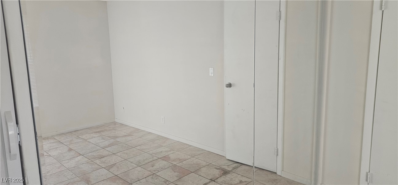 1344 Lorilyn Avenue, Unit 2 Las Vegas, NV 89119 - Photo 13 of 15 Empty room featuring baseboards