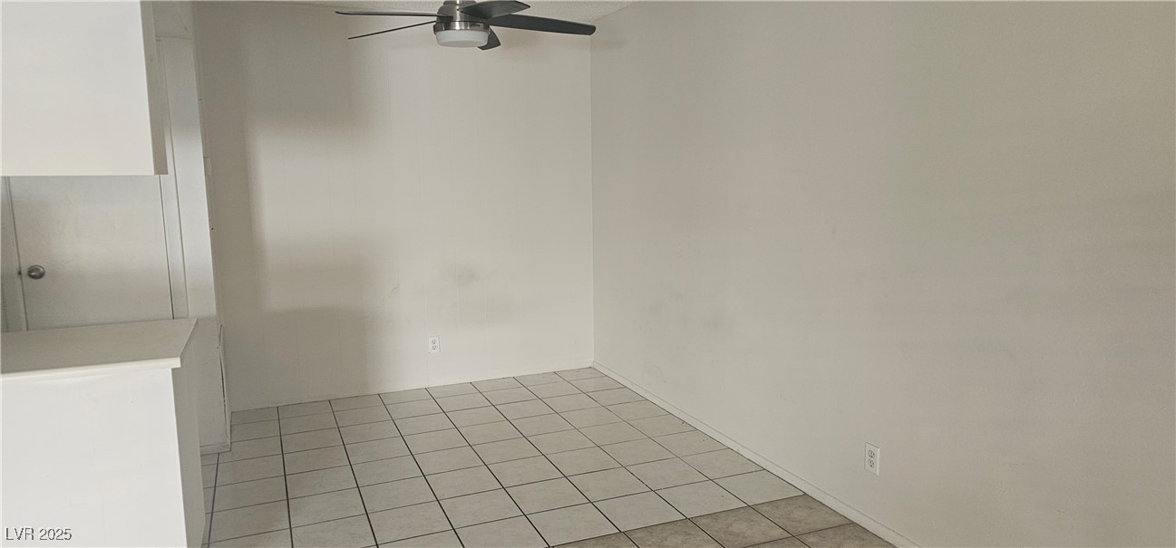 1344 Lorilyn Avenue, Unit 2 Las Vegas, NV 89119 - Photo 7 of 15 Unfurnished room with light tile patterned floors and a ceiling fan