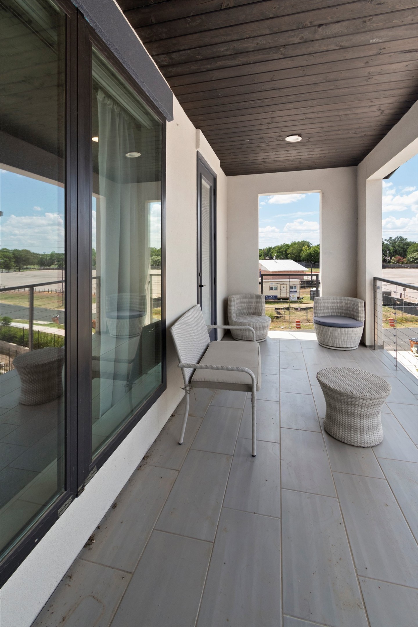 13309 Morris Road, Unit 62 Austin, TX 78729 - Photo 6 of 21 An inviting balcony with sleek tile flooring offers elevated outdoor living space.