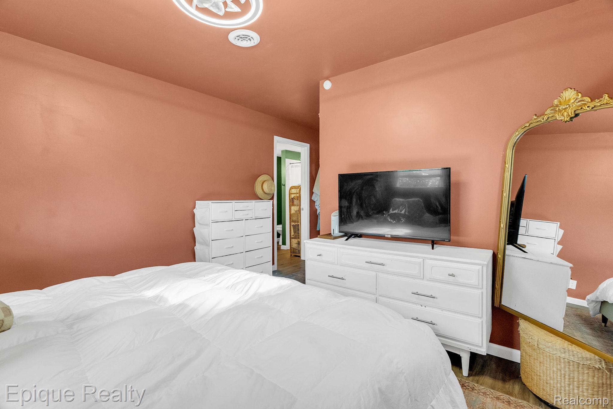 2182 North Center Road Burton, MI 48509 - Photo 21 of 34 Room with peach-toned walls and wood-finish flooring