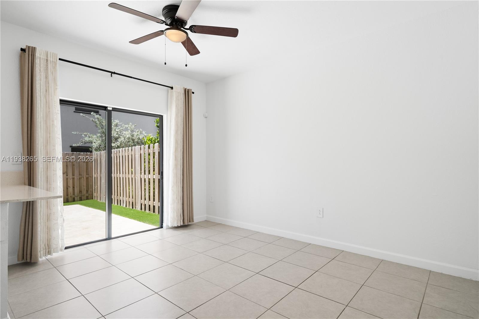 13388 Southwest 286th Street Homestead, FL 33033 - Photo 12 of 46 a view of empty room with wooden floor and fan