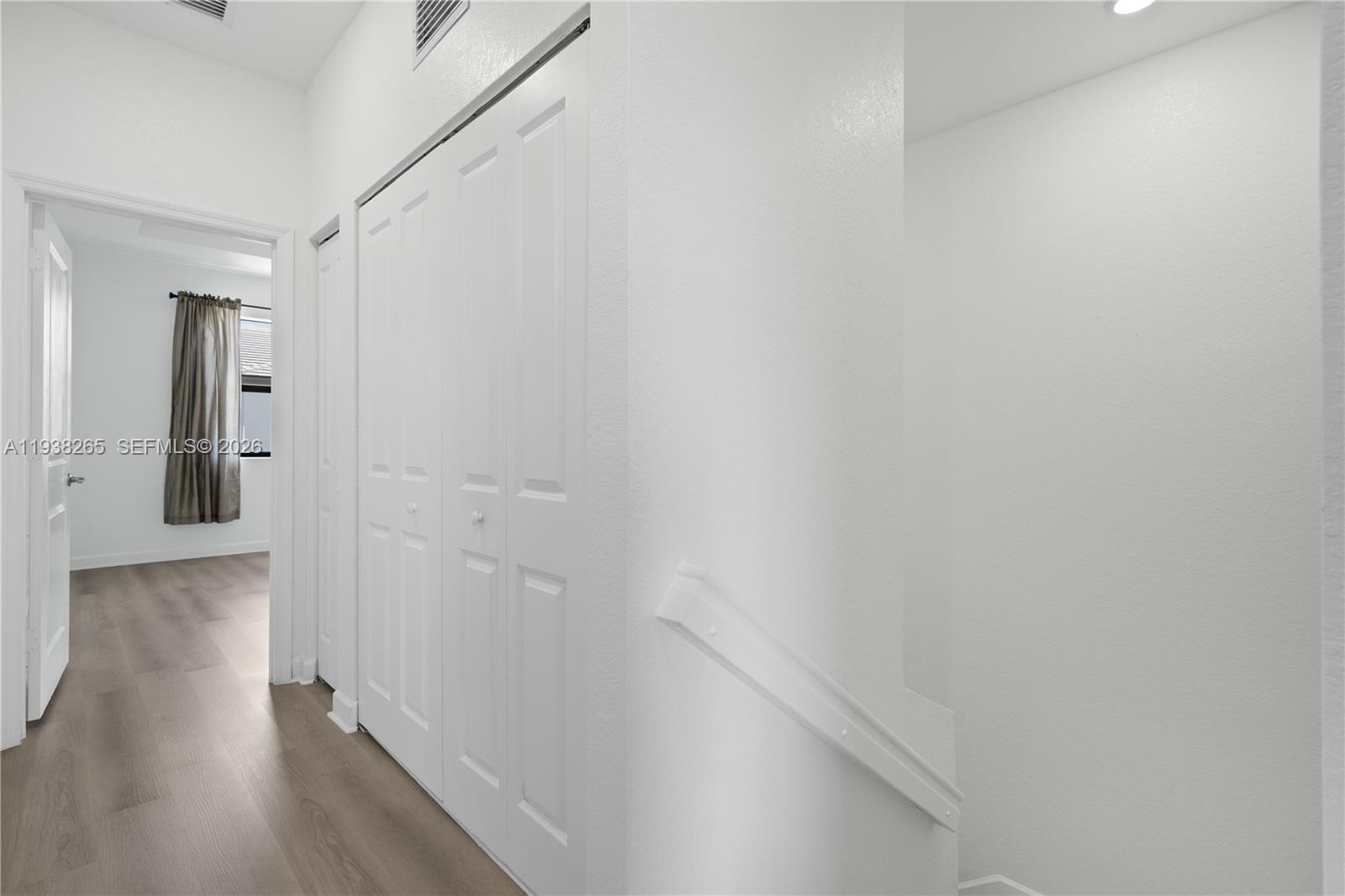 13388 Southwest 286th Street Homestead, FL 33033 - Photo 13 of 46 a view of a hallway with wooden floor