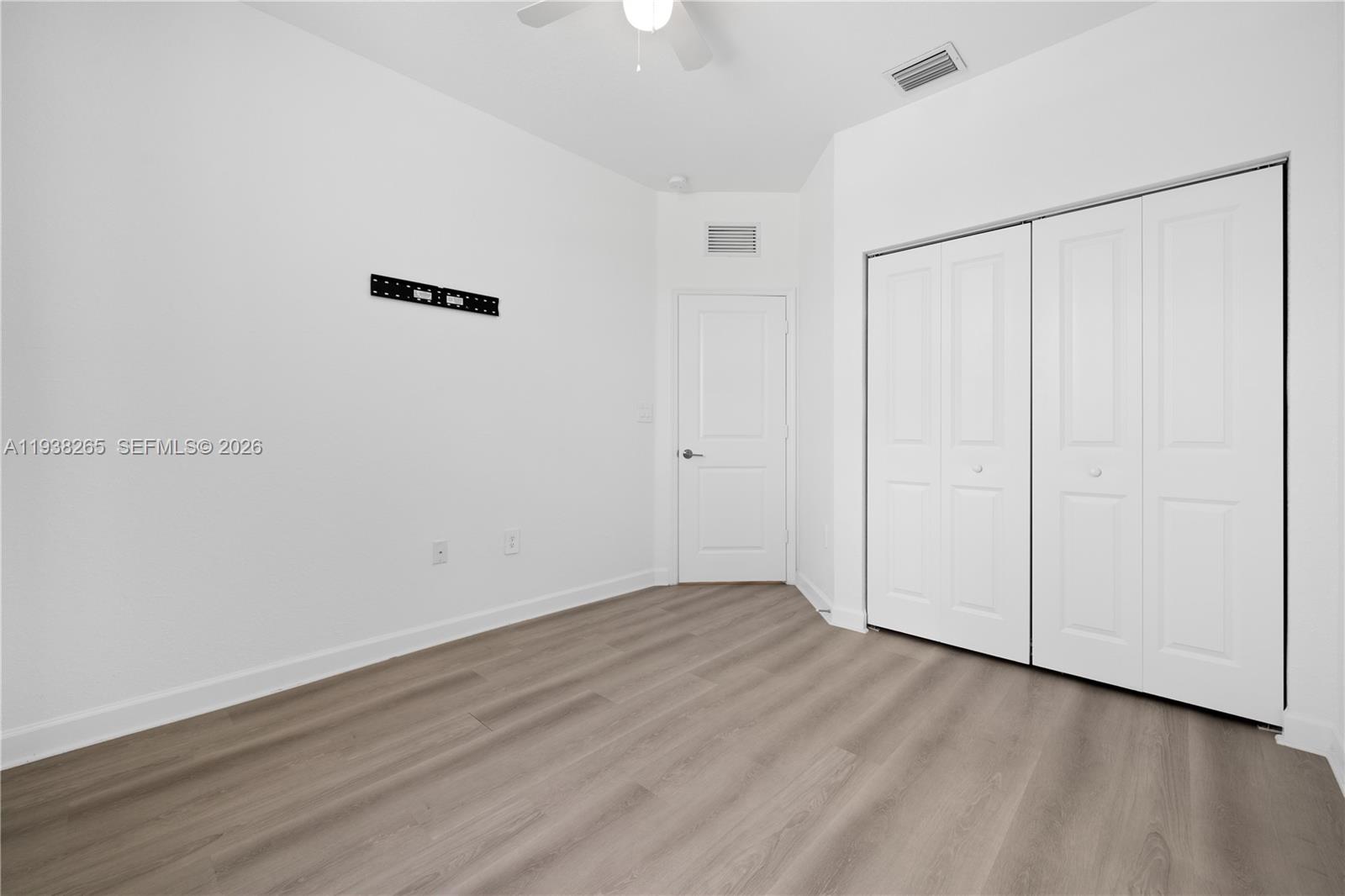13388 Southwest 286th Street Homestead, FL 33033 - Photo 18 of 46 wooden floor in an empty room