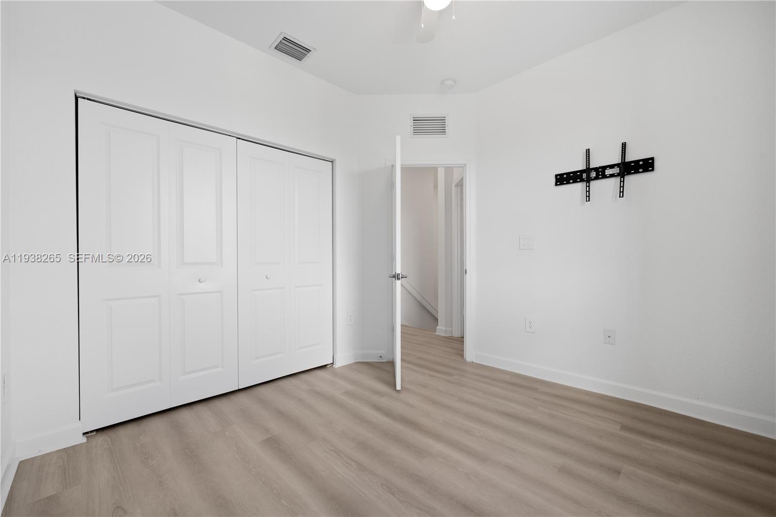 13388 Southwest 286th Street Homestead, FL 33033 - Photo 19 of 46 a view of a room with wooden floor