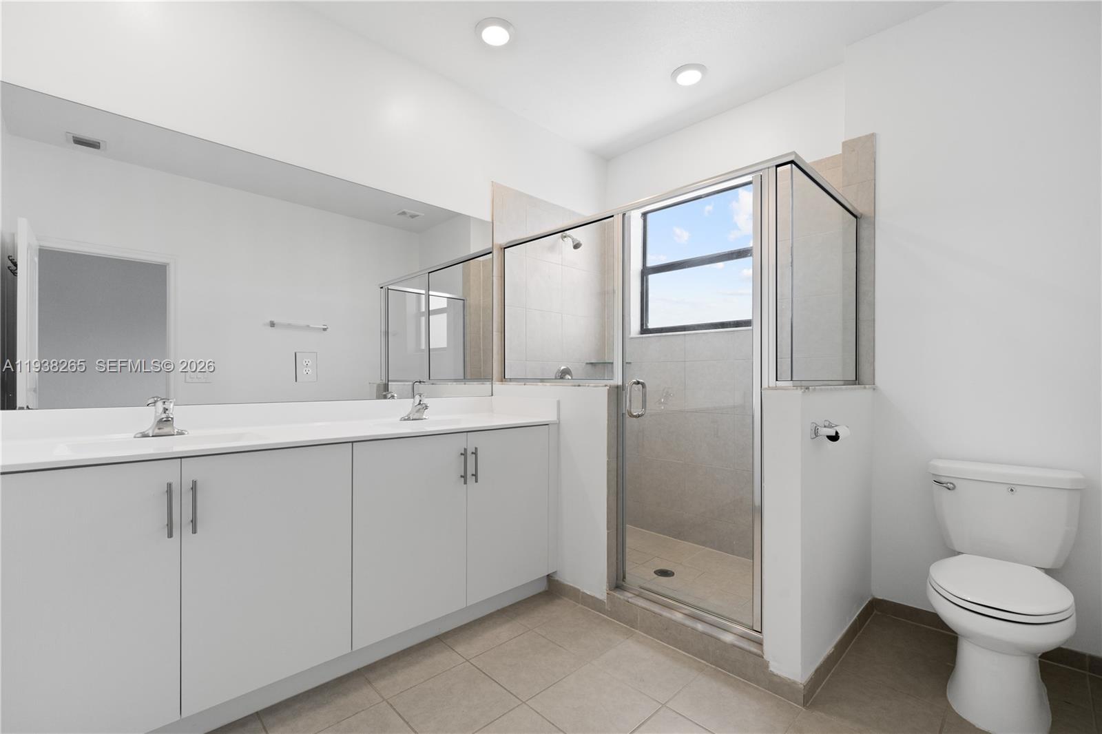 13388 Southwest 286th Street Homestead, FL 33033 - Photo 25 of 46 a bathroom with a toilet sink and shower