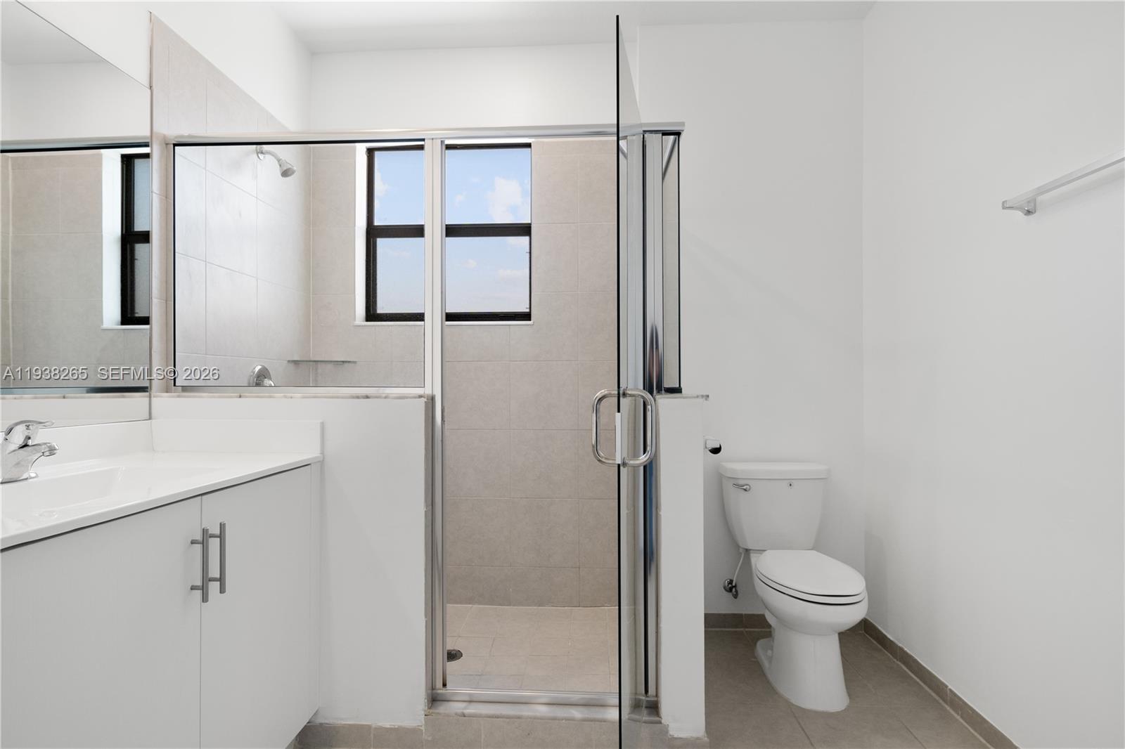 13388 Southwest 286th Street Homestead, FL 33033 - Photo 26 of 46 a bathroom with a toilet sink and shower