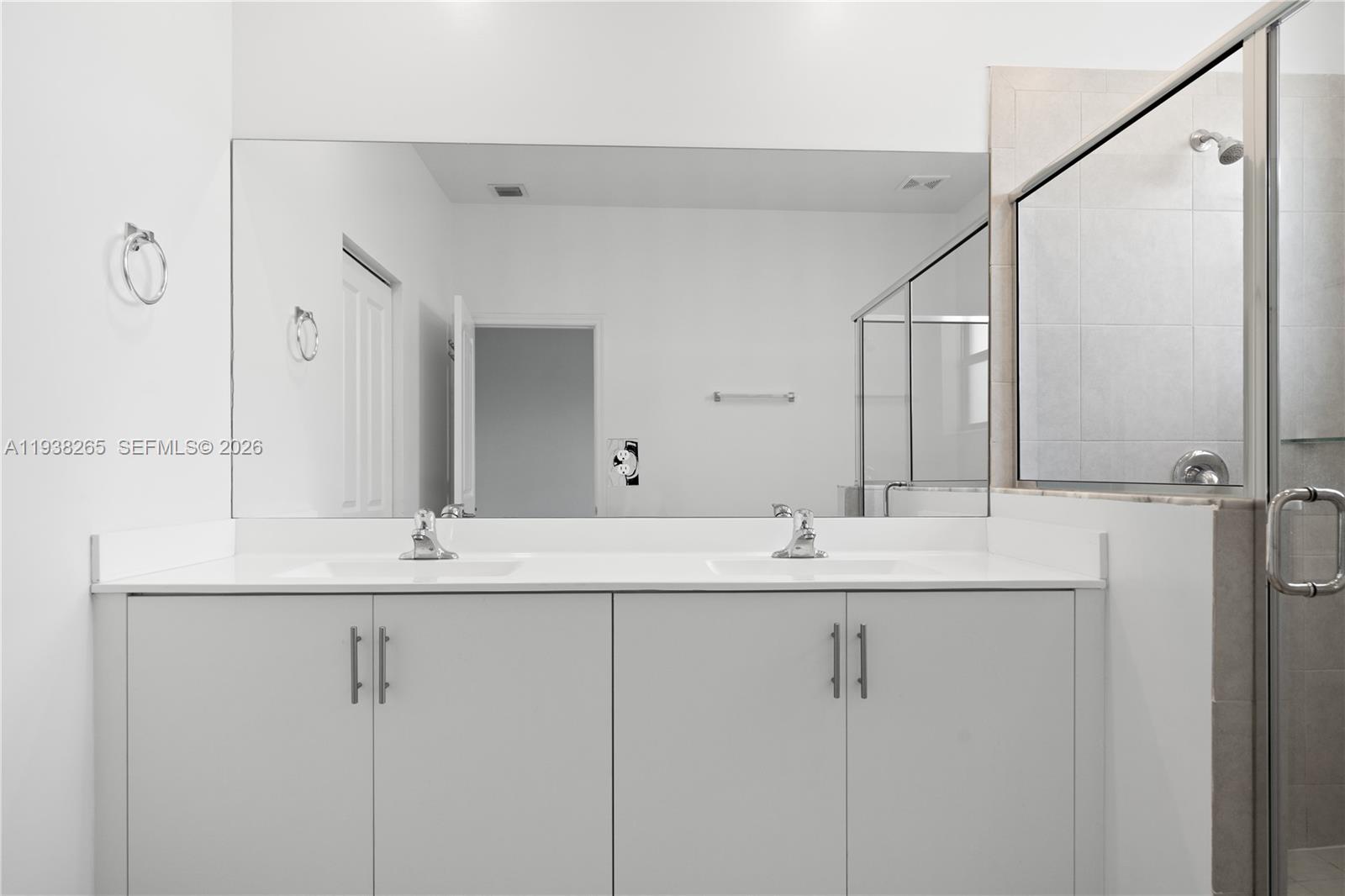 13388 Southwest 286th Street Homestead, FL 33033 - Photo 27 of 46 a bathroom with a double vanity sink and mirror