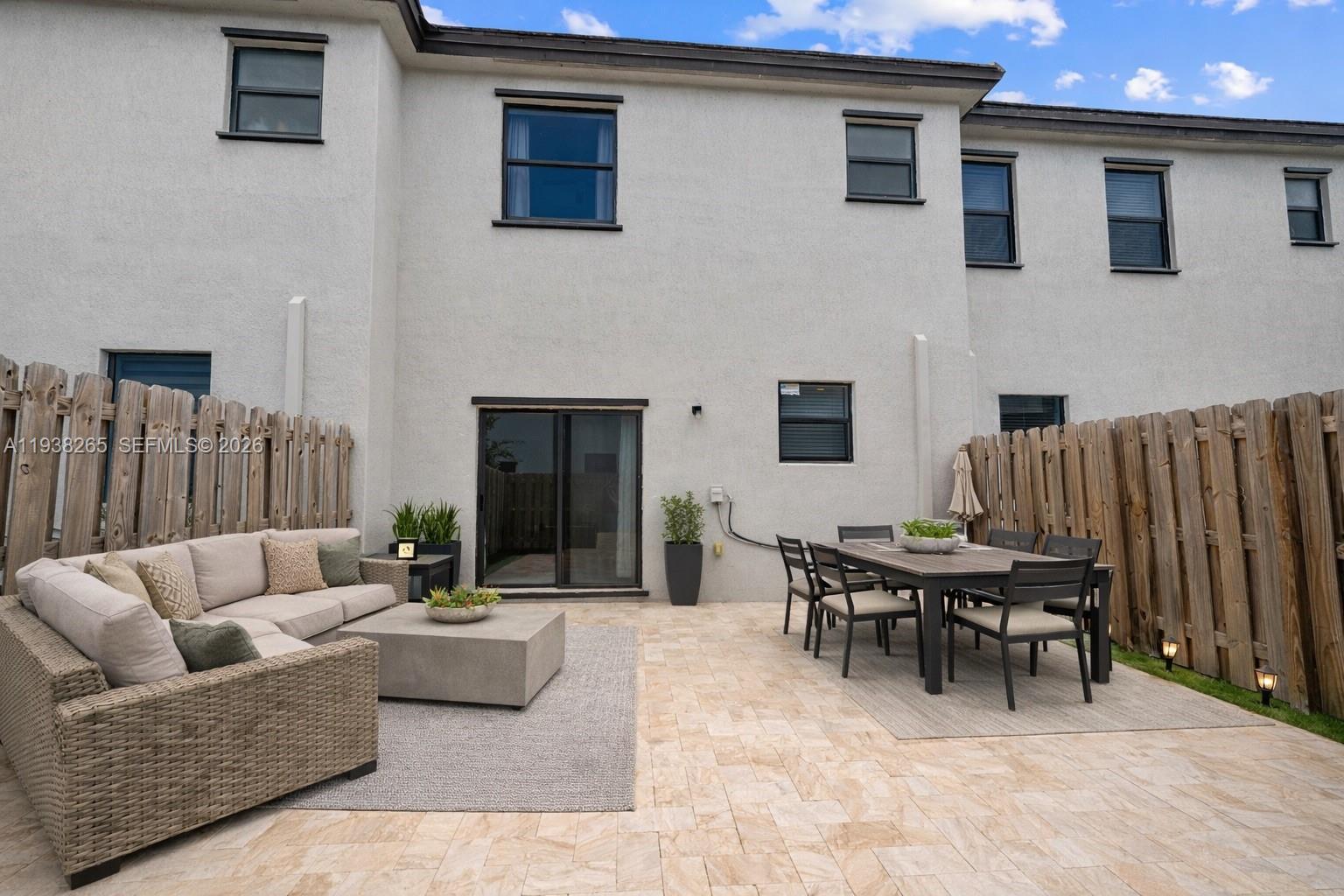 13388 Southwest 286th Street Homestead, FL 33033 - Photo 29 of 46 a outdoor space with patio furniture and a fireplace