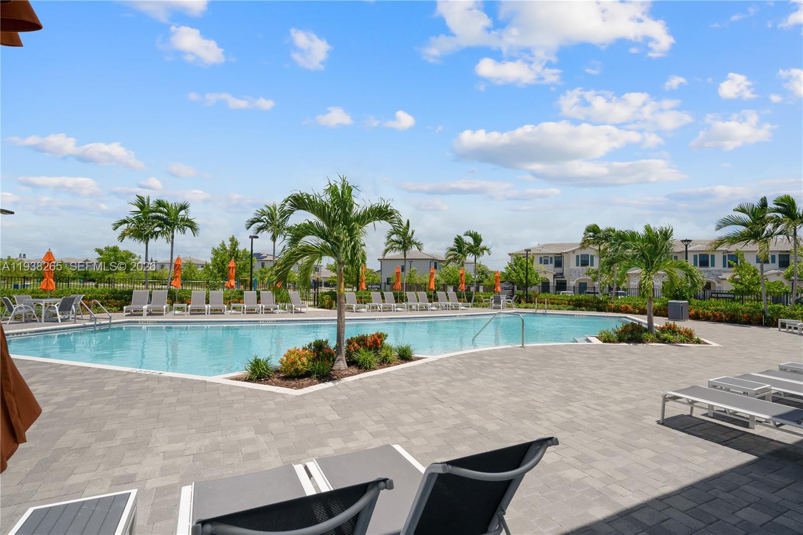 13388 Southwest 286th Street Homestead, FL 33033 - Photo 37 of 46 a view of a swimming pool with an outdoor seating