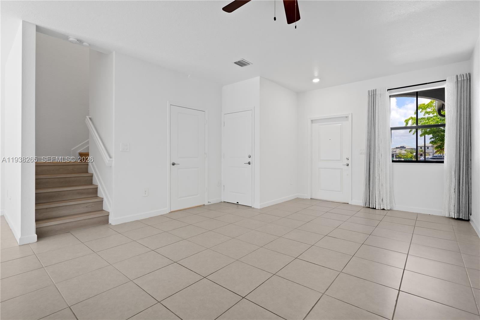 13388 Southwest 286th Street Homestead, FL 33033 - Photo 5 of 46 a view of an empty room with a window