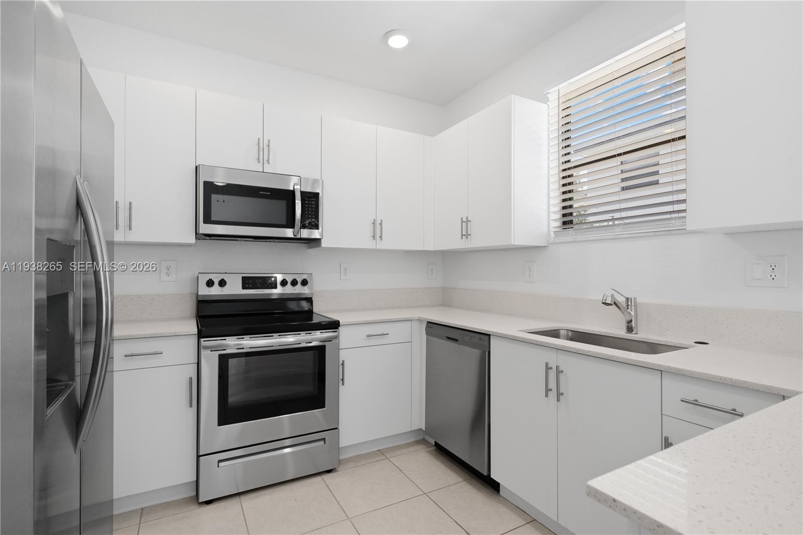 13388 Southwest 286th Street Homestead, FL 33033 - Photo 8 of 46 a kitchen with cabinets stainless steel appliances and sink