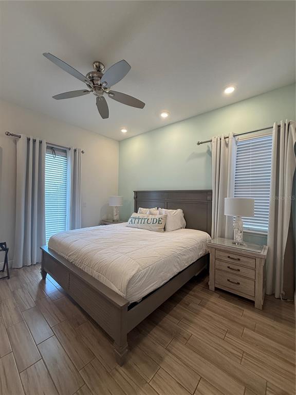 2986 Salted Rim Road Kissimmee, FL 34747 - Photo 15 of 32 a bedroom with a bed and a mirror