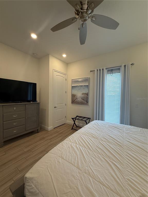 2986 Salted Rim Road Kissimmee, FL 34747 - Photo 20 of 32 a bedroom with a bed and a flat screen tv