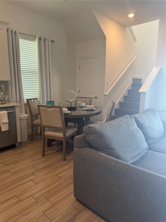 2986 Salted Rim Road Kissimmee, FL 34747 - Photo 10 of 32 a living room with couches chairs and couches with wooden floor