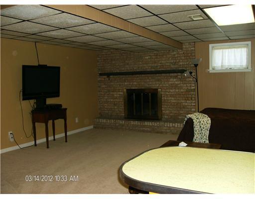 648 Alexander Avenue Monaca, PA 15061 - Photo 8 of 18 Family Room. *Spacious Family Room with Functional Brick Fireplace*