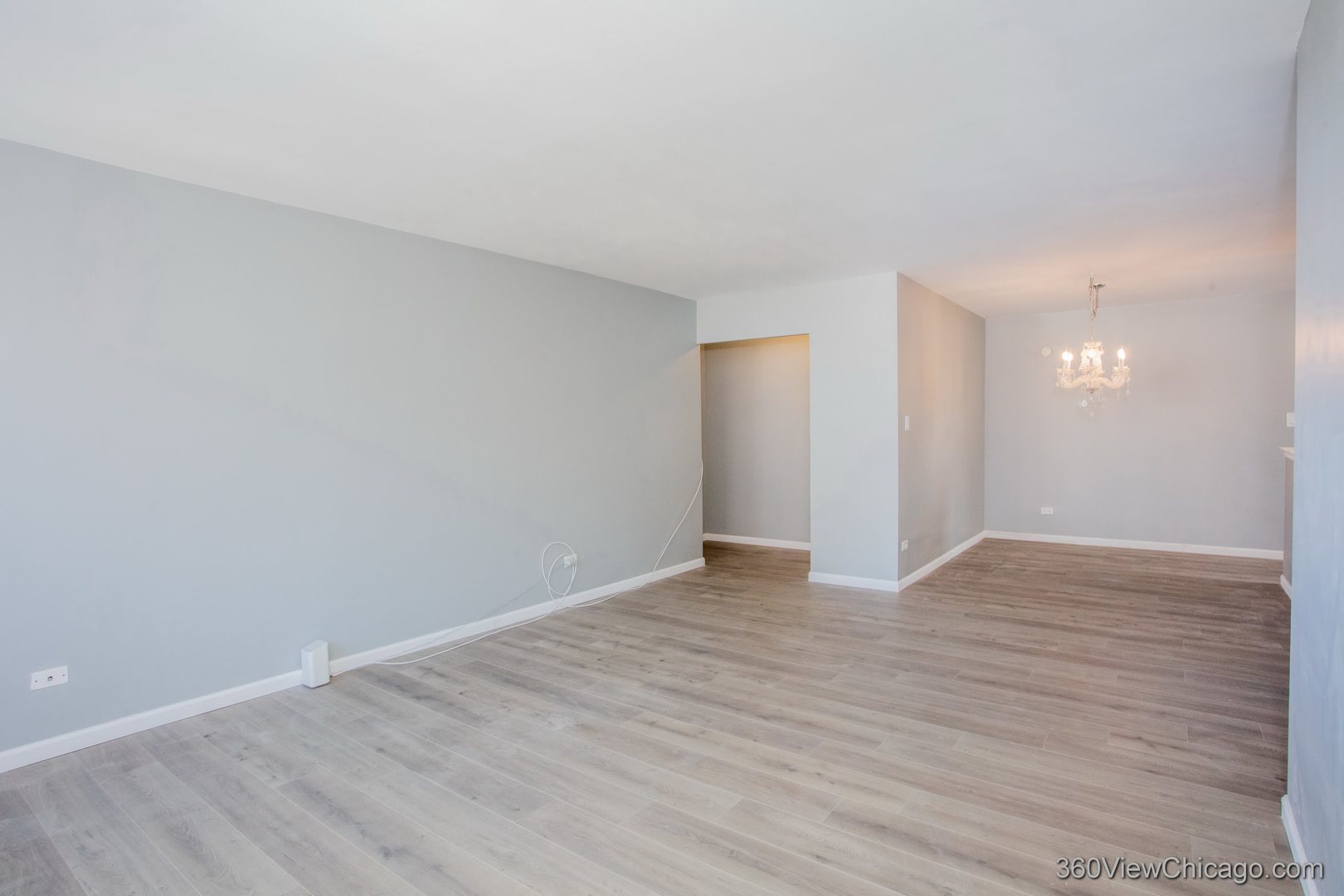 6300 North Sheridan Road, Unit 517 Chicago, IL 60660 - Photo 12 of 13 a view of an empty room with wooden floor