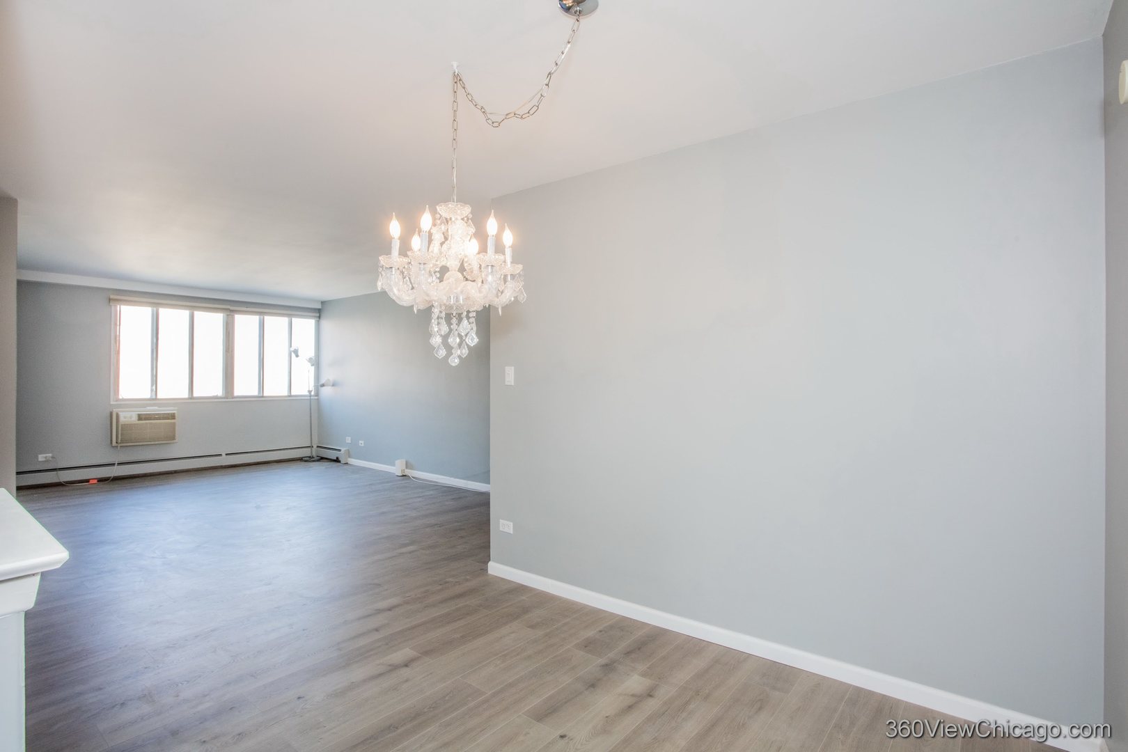 6300 North Sheridan Road, Unit 517 Chicago, IL 60660 - Photo 13 of 13 a view of a chandelier in big room and window
