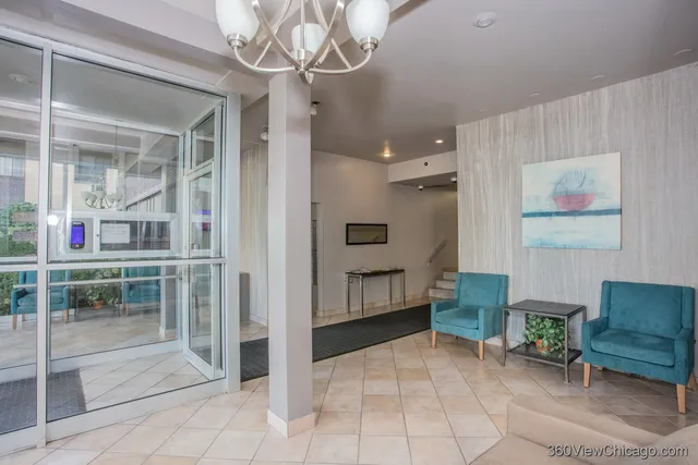 a view of a livingroom with furniture and windows