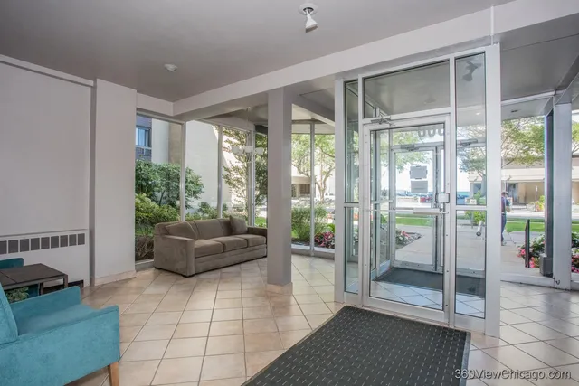 a living room with furniture and windows