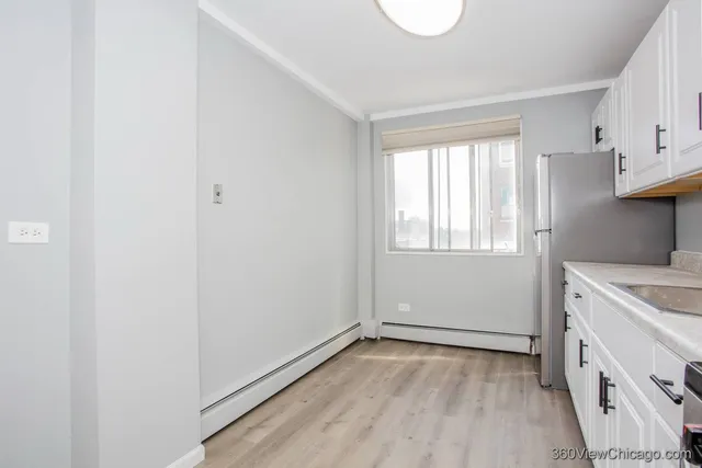 a view of a kitchen with a sink cabinets and a window