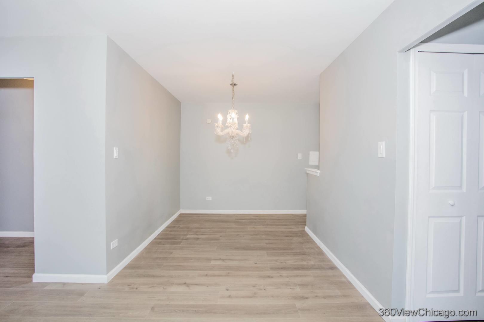 6300 North Sheridan Road, Unit 517 Chicago, IL 60660 - Photo 10 of 13 a view of an empty room with wooden floor