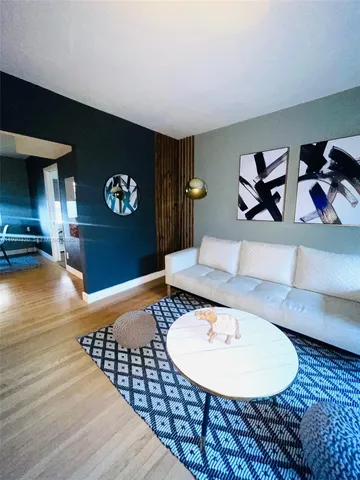 a room with furniture and wooden floor