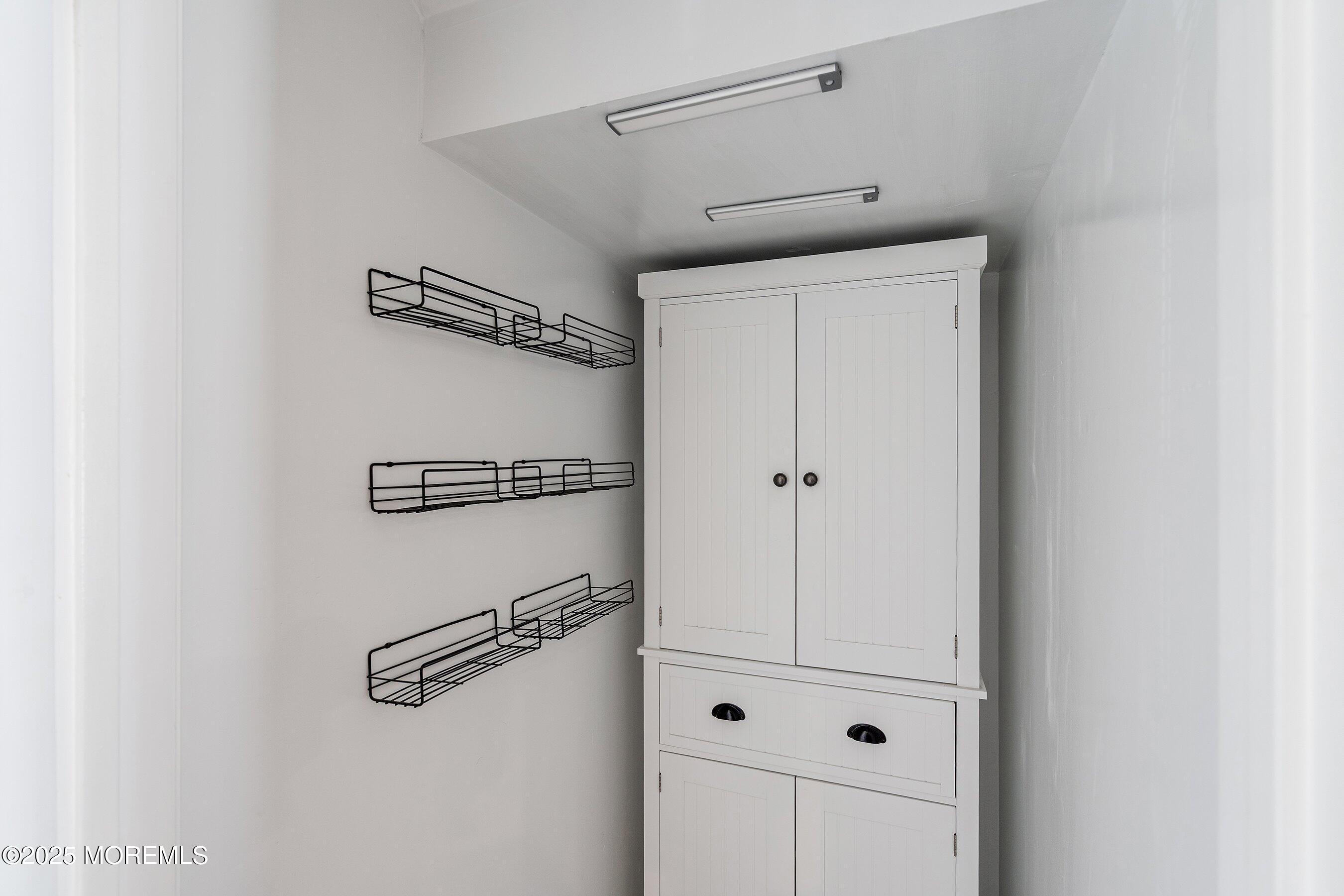 131 Starlight Road Howell, NJ 07731 - Photo 11 of 35 a view of a room with rack on the wall