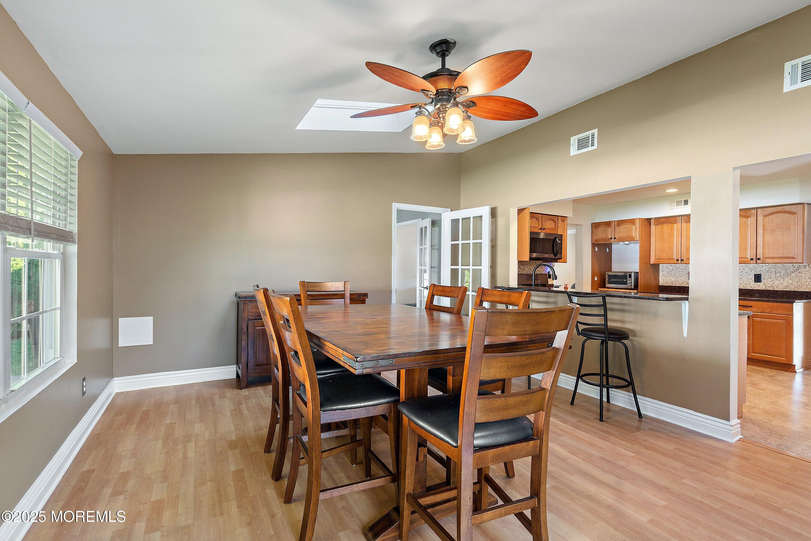 131 Starlight Road Howell, NJ 07731 - Photo 13 of 35 a view of a dining room with furniture window and wooden floor
