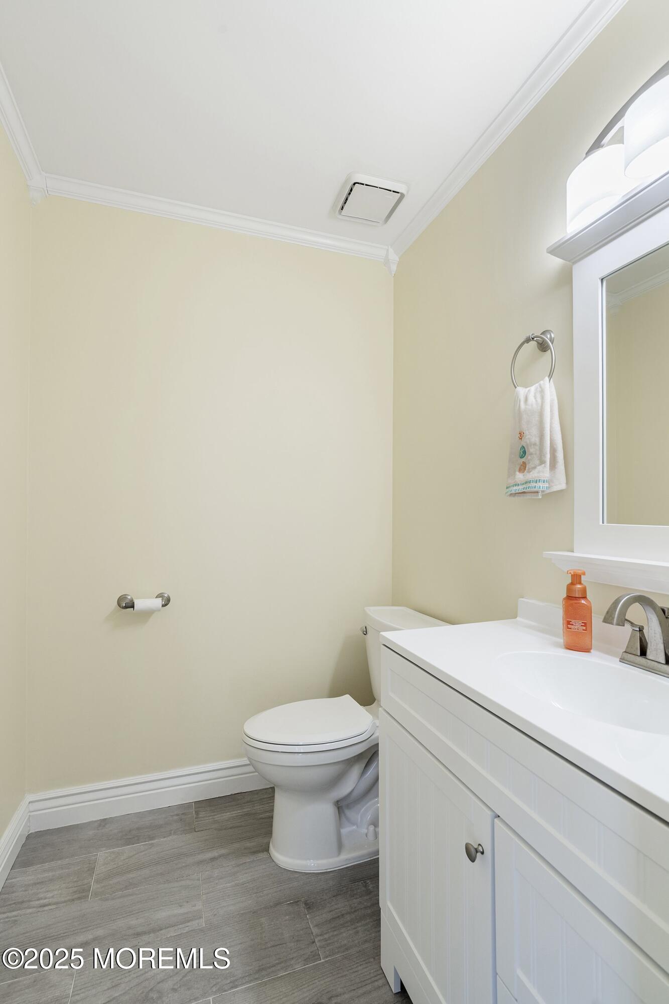 131 Starlight Road Howell, NJ 07731 - Photo 16 of 35 a bathroom with a toilet and a sink