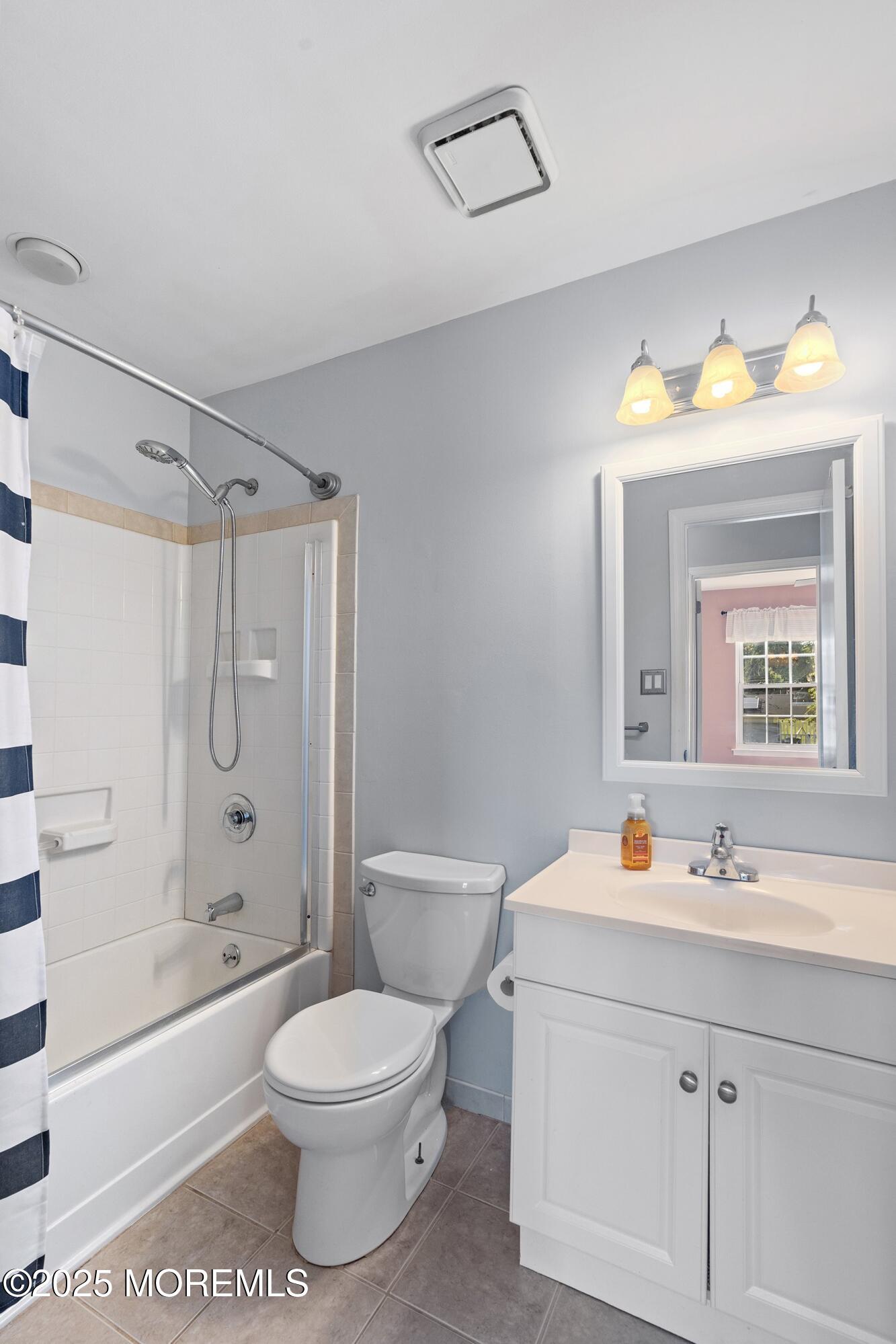 131 Starlight Road Howell, NJ 07731 - Photo 18 of 35 a bathroom with a toilet a sink a mirror a bathtub and vanity