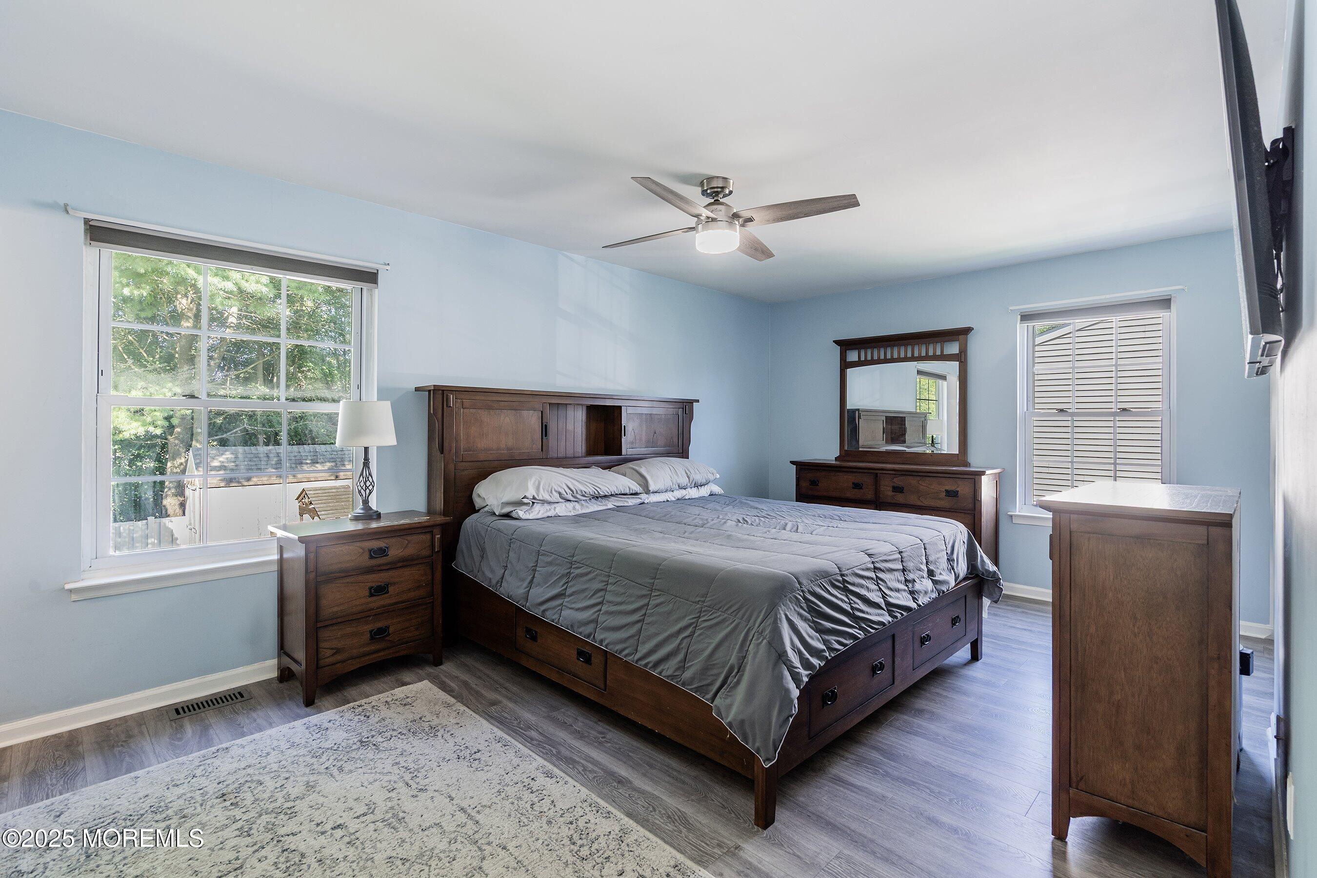 131 Starlight Road Howell, NJ 07731 - Photo 19 of 35 a bedroom with a large bed and a window