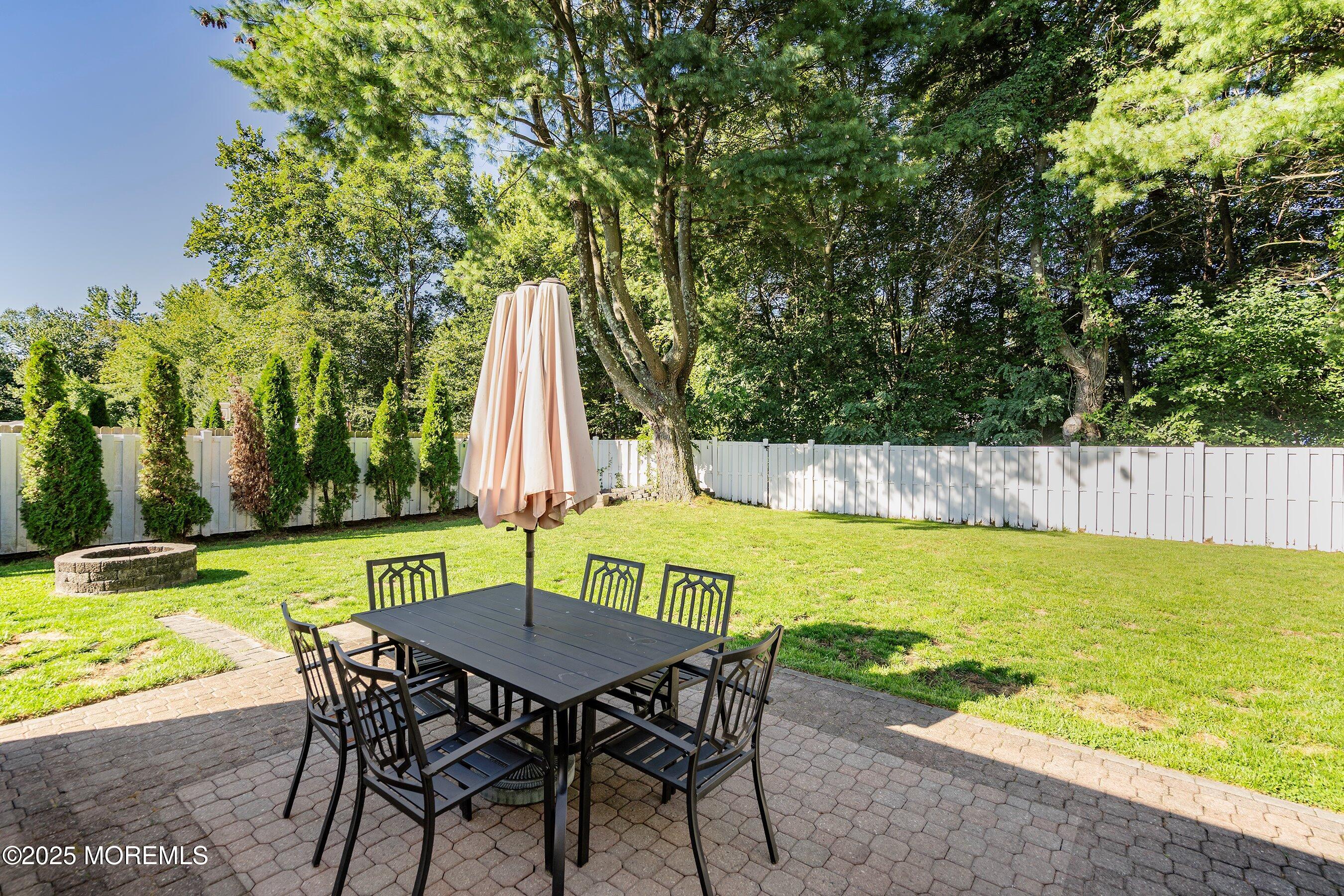 131 Starlight Road Howell, NJ 07731 - Photo 23 of 35 an outdoor sitting area with swimming pool