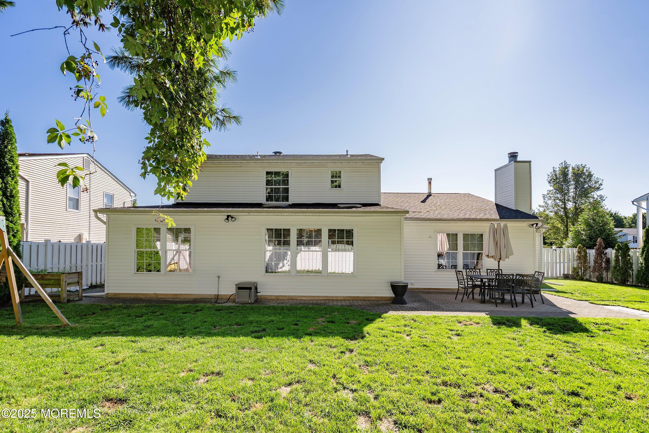 131 Starlight Road Howell, NJ 07731 - Photo 25 of 35 a front view of a house with a yard