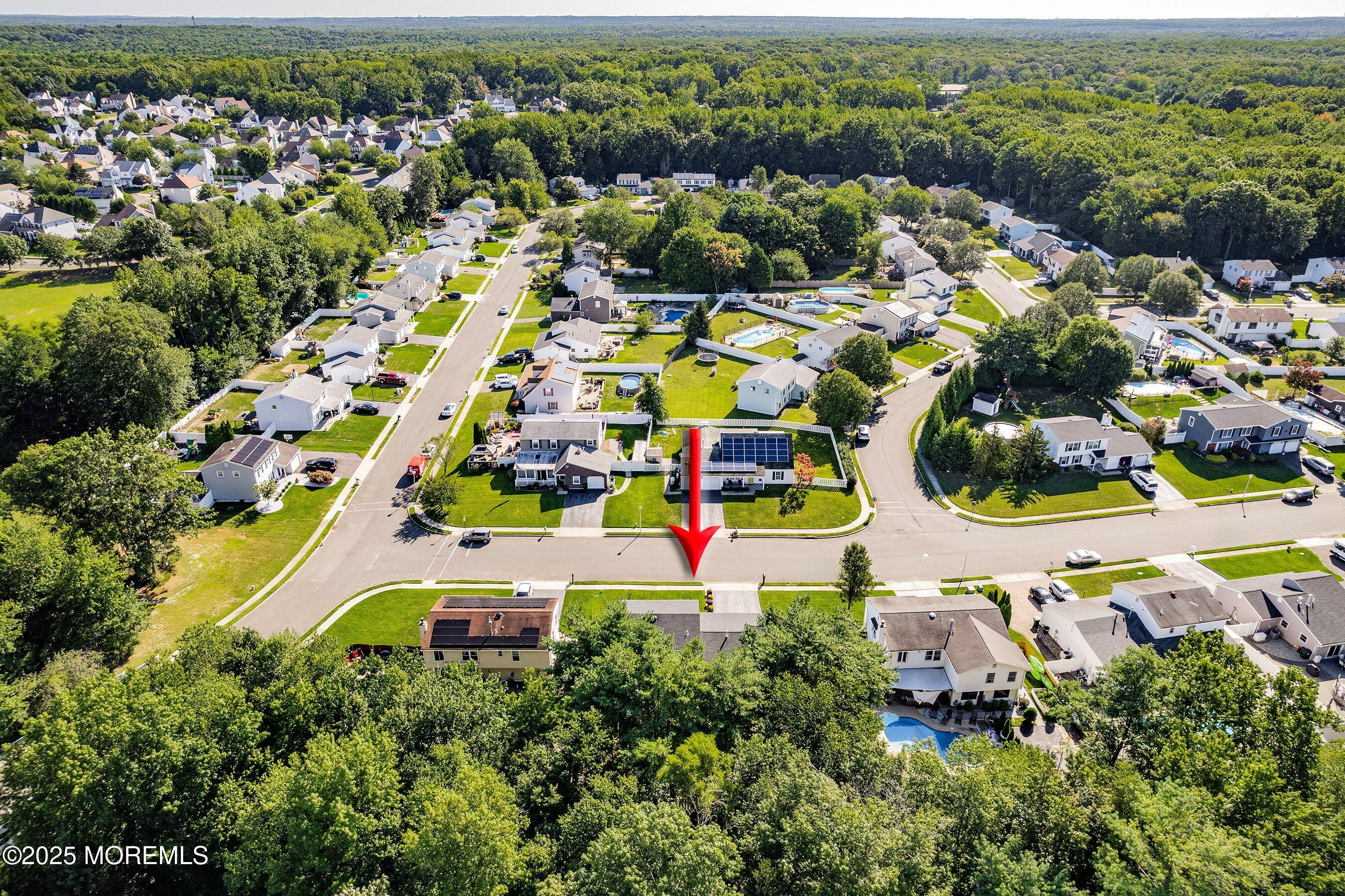 131 Starlight Road Howell, NJ 07731 - Photo 27 of 35 an aerial view of residential houses with outdoor space and swimming pool