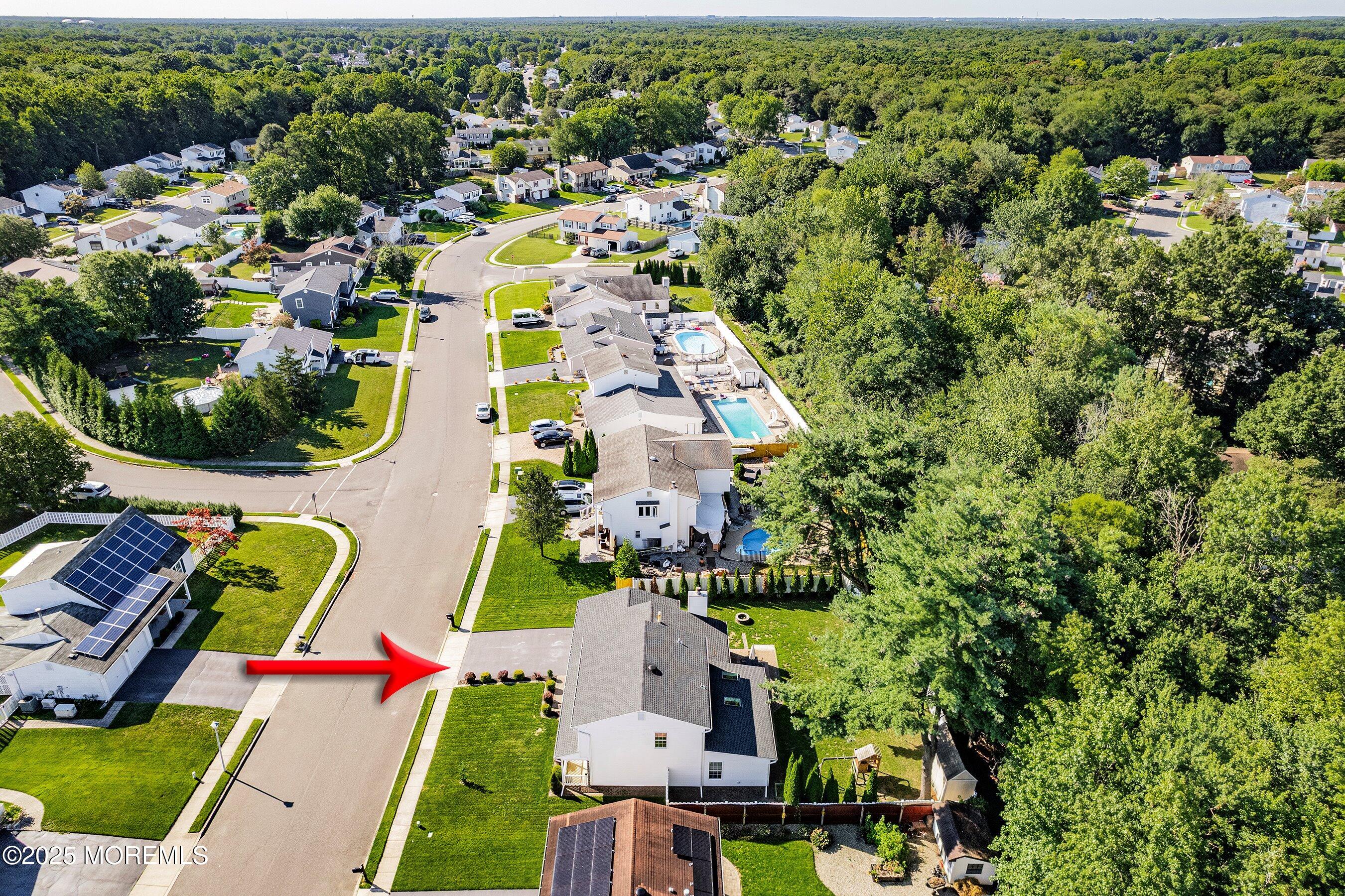 131 Starlight Road Howell, NJ 07731 - Photo 28 of 35 an aerial view of residential houses with outdoor space and parking