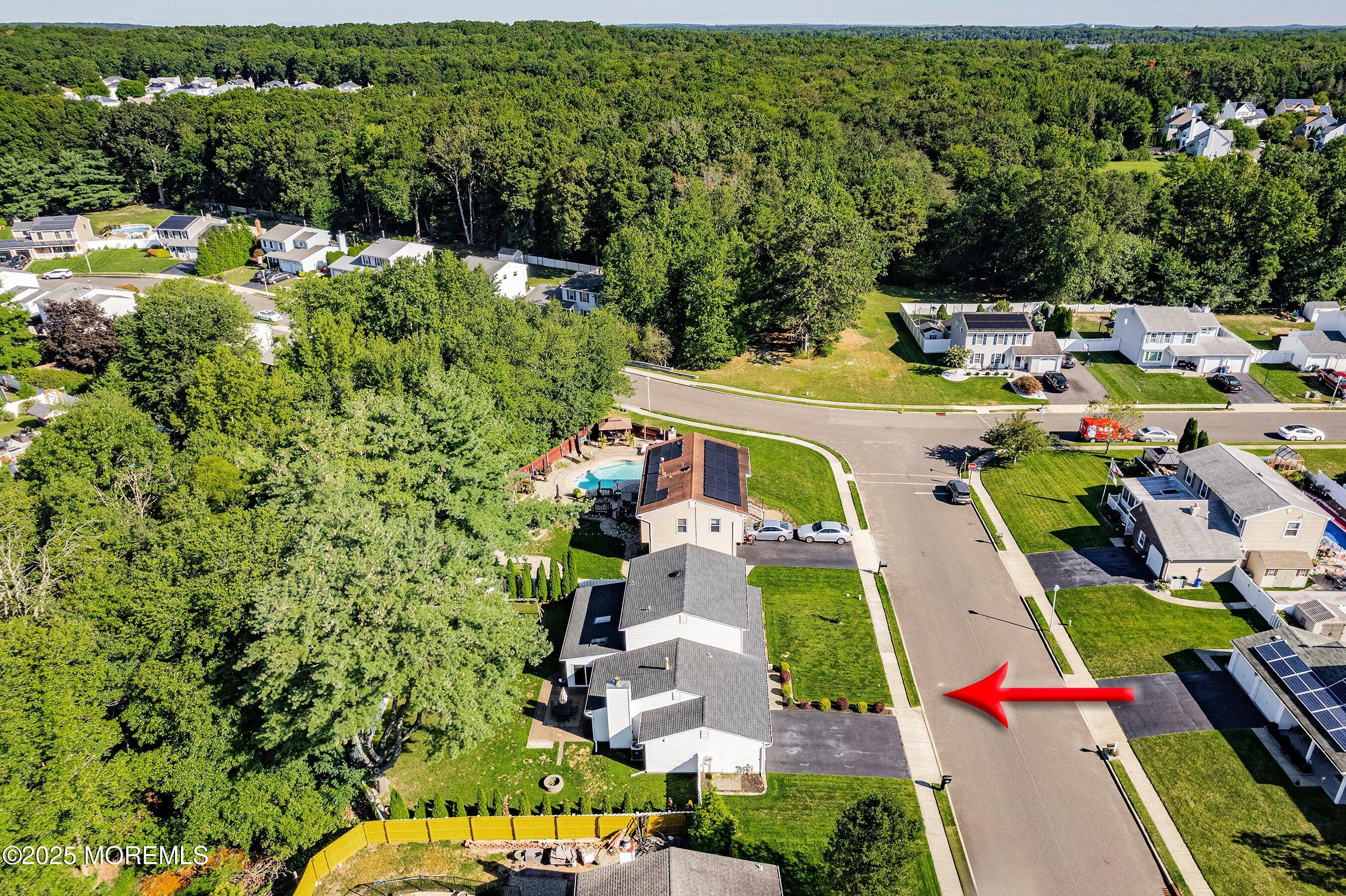 131 Starlight Road Howell, NJ 07731 - Photo 29 of 35 an aerial view of residential houses with outdoor space and swimming pool